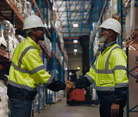 Workers shaking hands